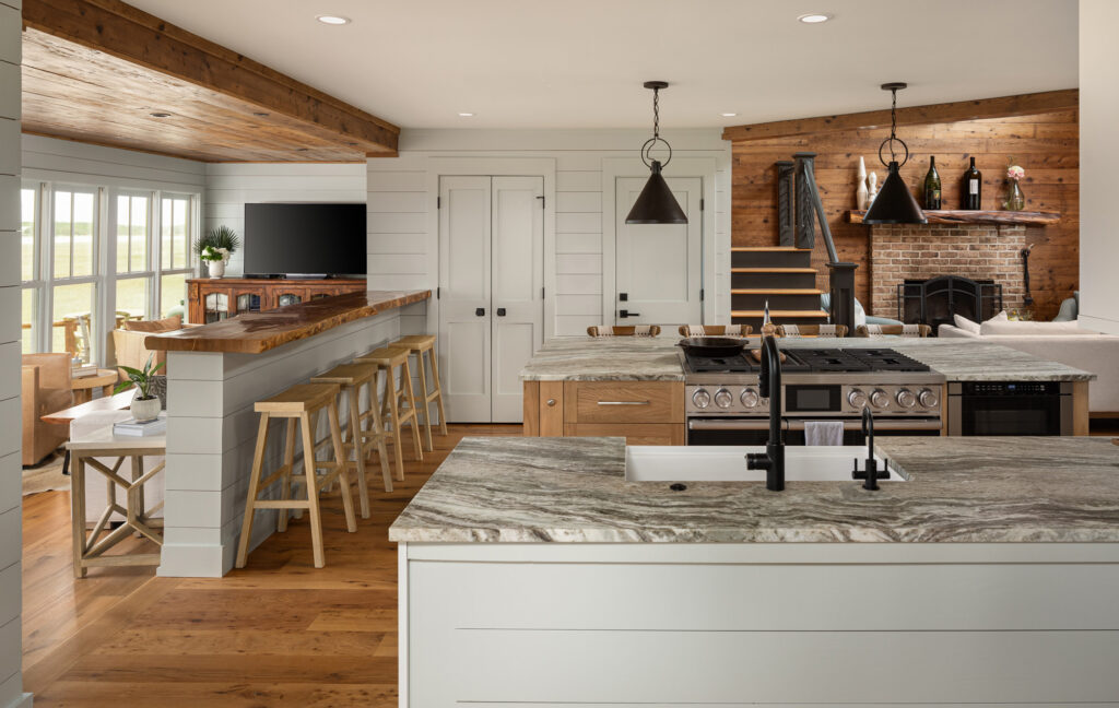 image of a kitchen renovation with bar stools, sink, oven 