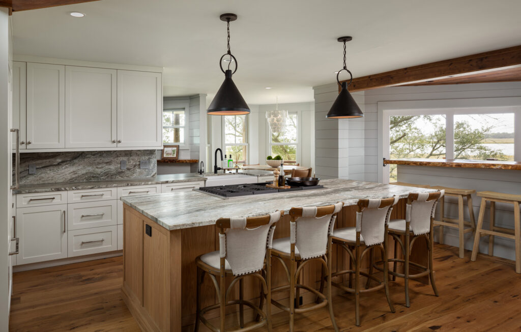 kitchen island with bar stools and black pendant lights - architectural design services