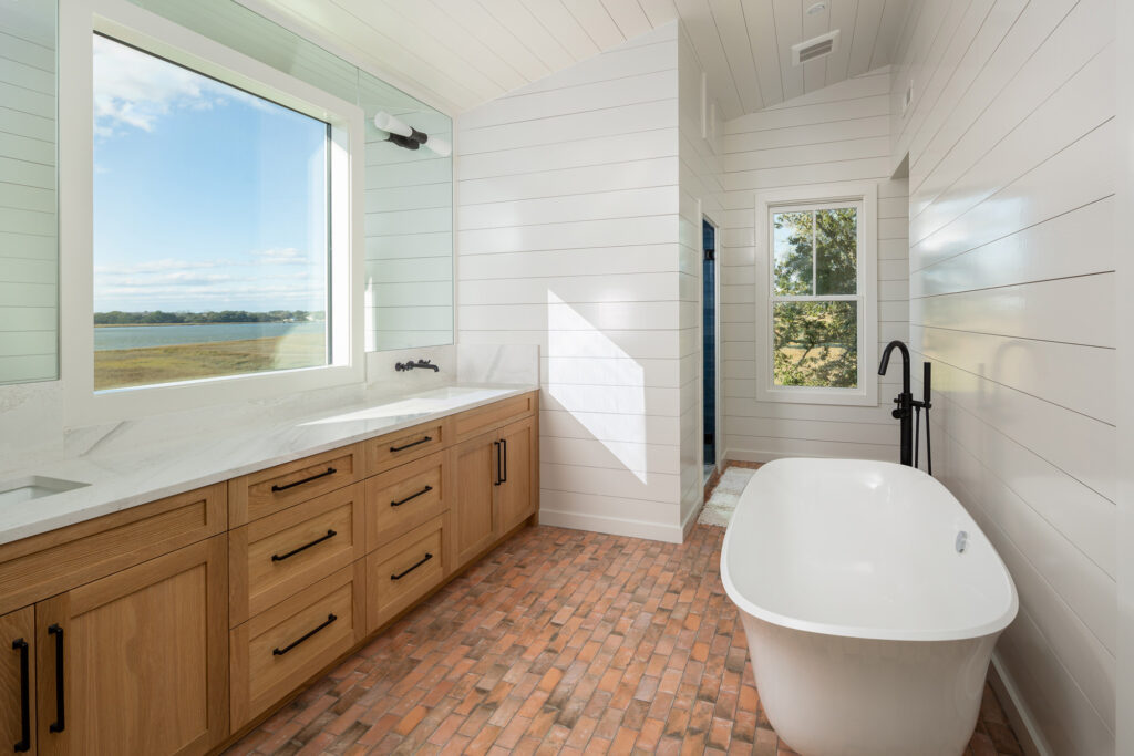 newly renovated bathroom with large windows looking out on the water. Garden tub - architectural design services