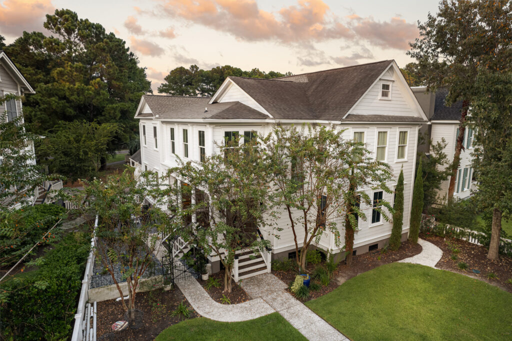 beautiful white home with lush green grass - our core values