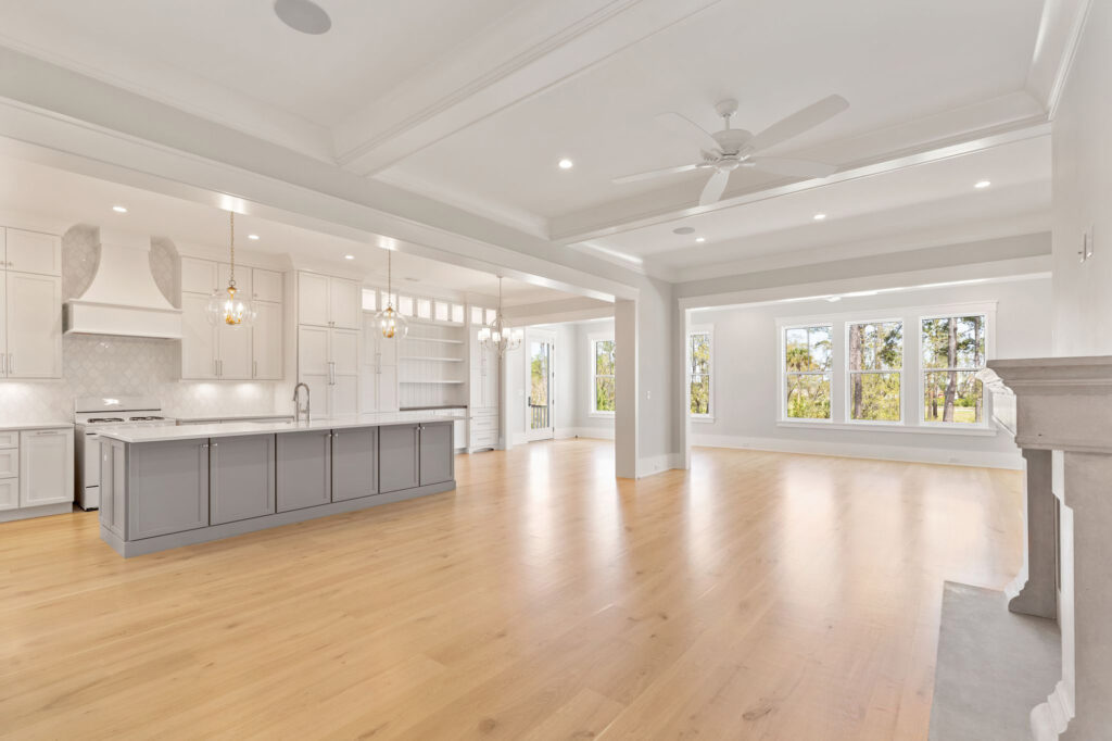 new kitchen and living room addition with grey cabinets and hardwood floors - charleston, SC