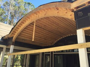 curved roof frame of house being built