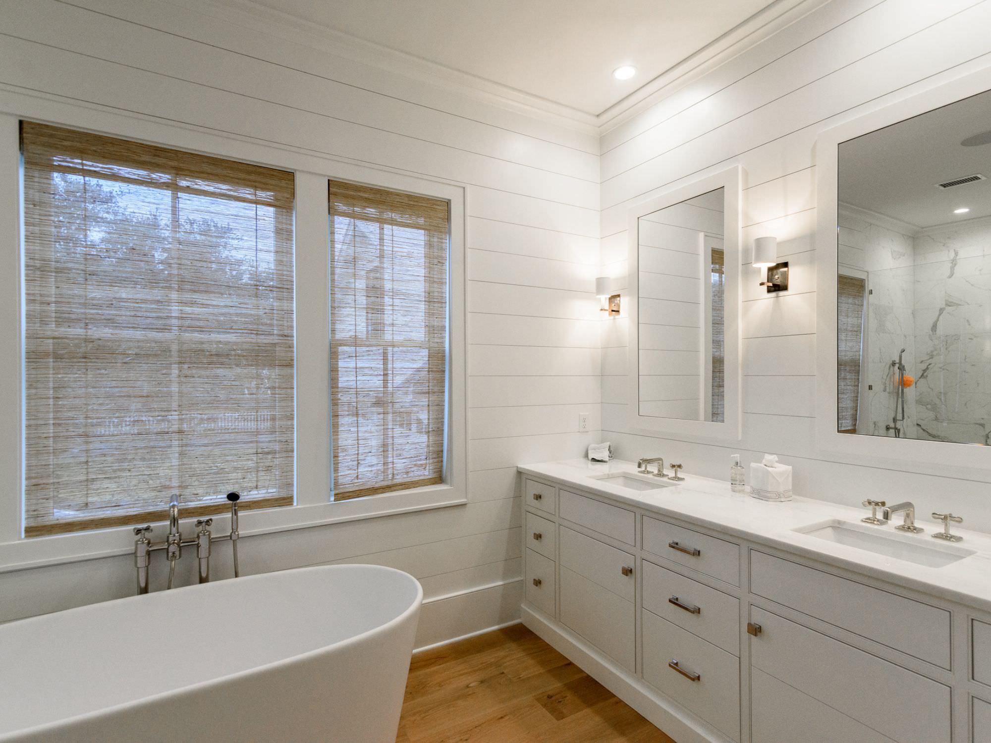 bathroom and vanity with blinds pulled down