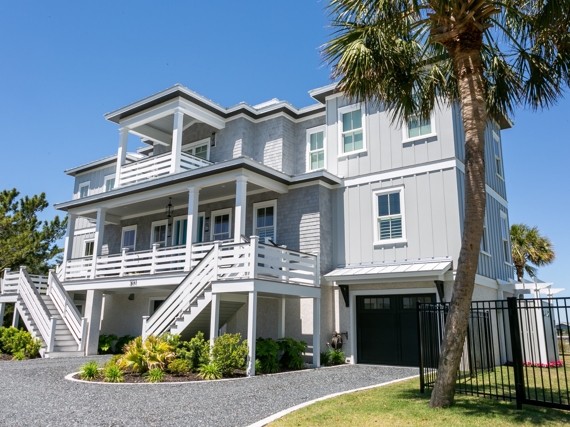 front of grey two story home with gravel driveway - award winning architects, Charleston, SC