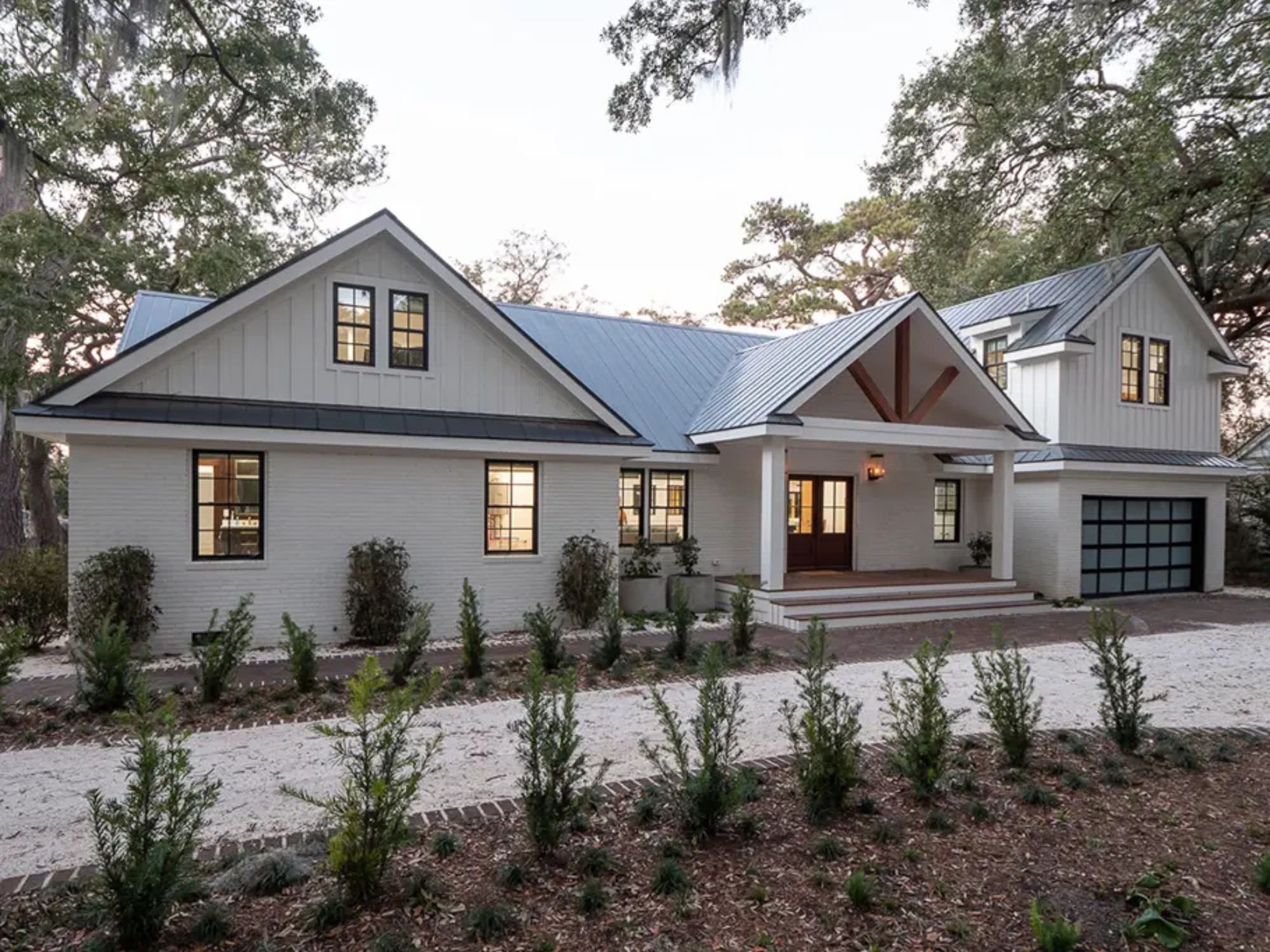 outside of white house with driveway and bushes - top architecture firms, charleston, SC