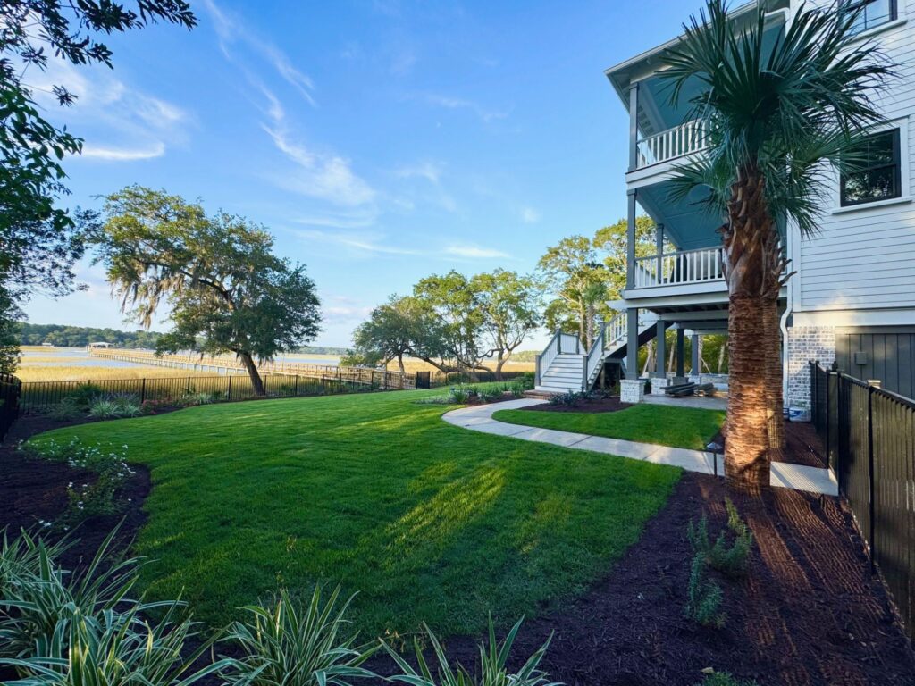 side view of white home and yard
