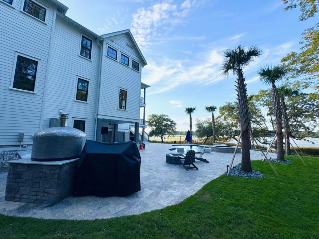 beautiful side view of white house on the water - mt. pleasant architects