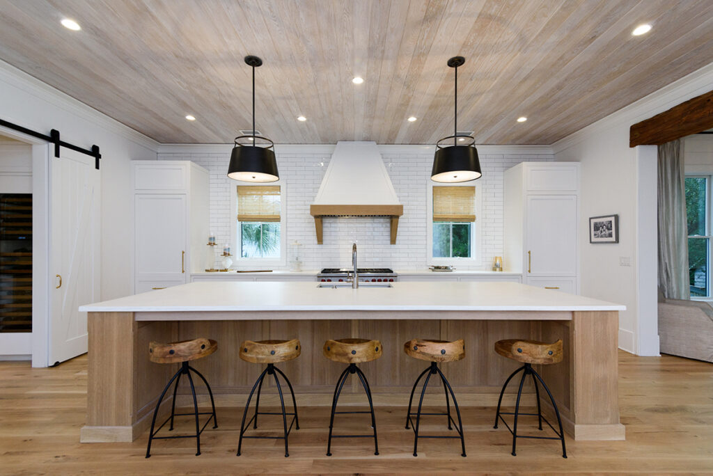 beautiful kitchen with bar stools - custom home renovation charleston, SC