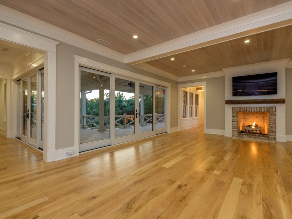 new living room with glass doors and fireplace - room addition
