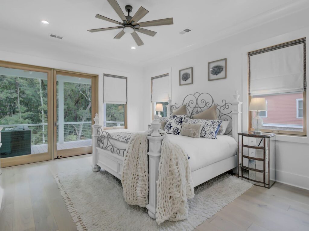 new bedroom and bed with french doors leading outside - room addition