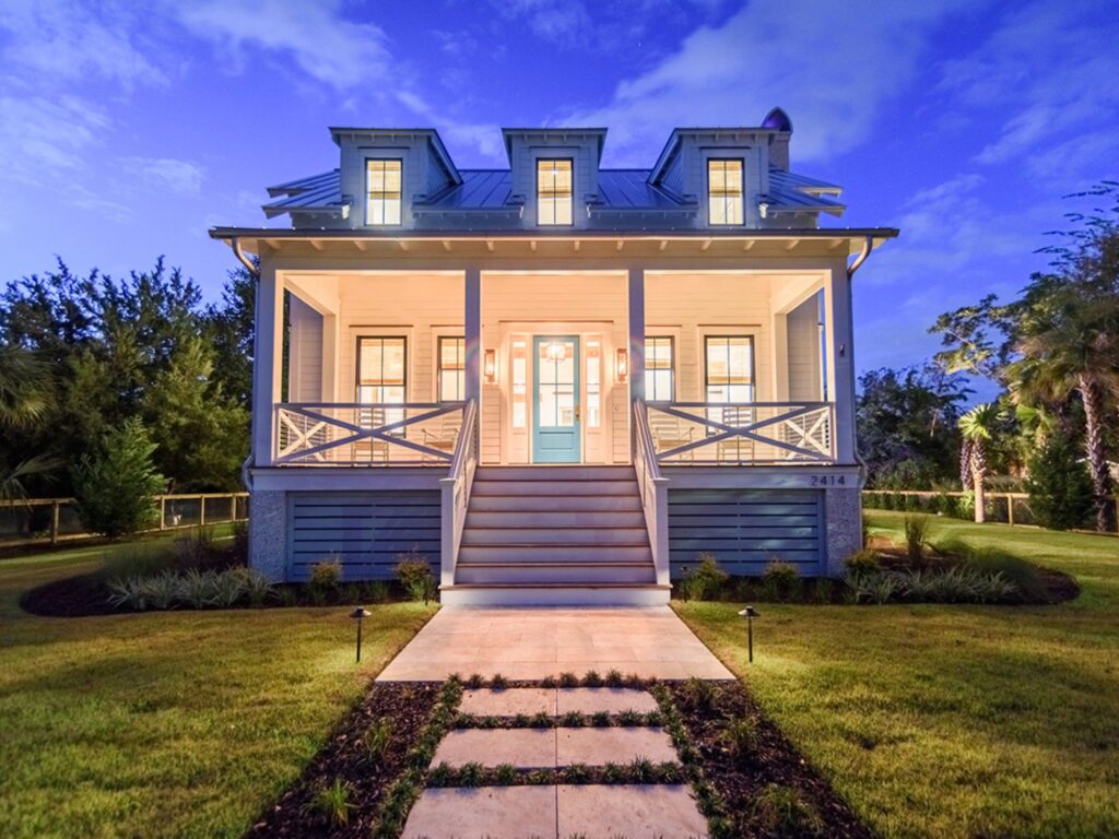 big home lit up at night - architect vs. interior designer, charleston, SC