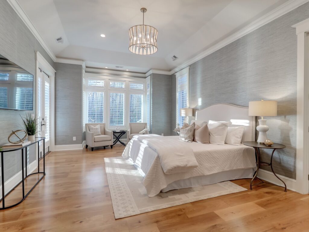 beautifully decorated bedroom with comfy bedding - architect vs. interior designer, charleston, SC