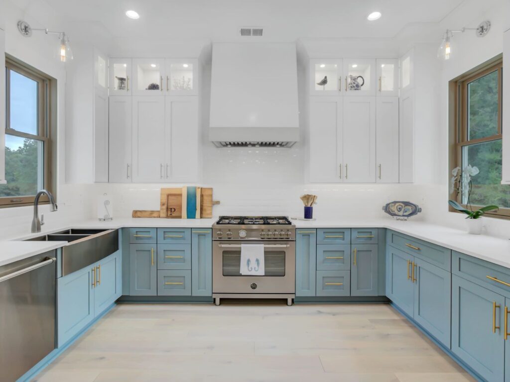 brand new kitchen with blue cabinets and stove