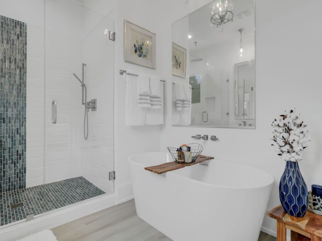 white garden tub with brown bathroom shelf - steps to remodel a bathroom