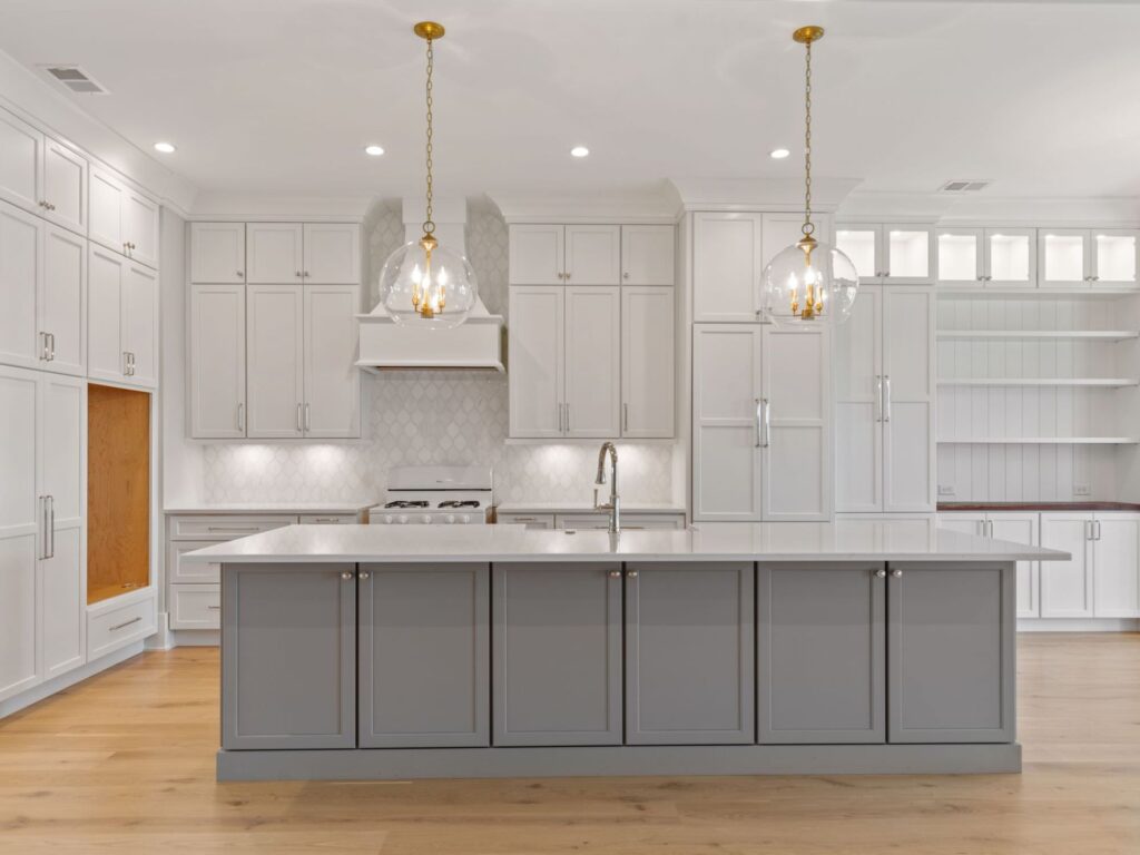 new kitchen floors and island with glass pendant lights - how to plan a kitchen remodel, charleston, SC
