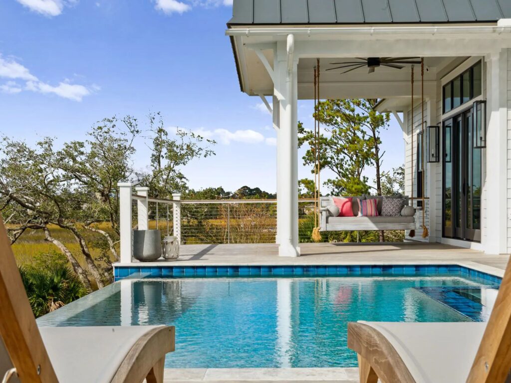 day bed and pool chairs by pool