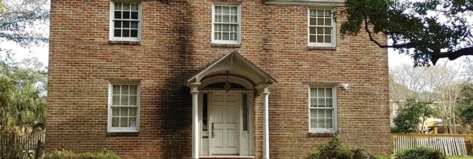 brown two story home - infill housing
