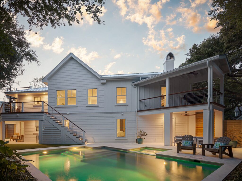 stunning home with pool at dusk - luxury residential architects